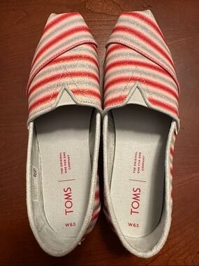Toms Slip-Ons with Red and Cream Stripe Accent